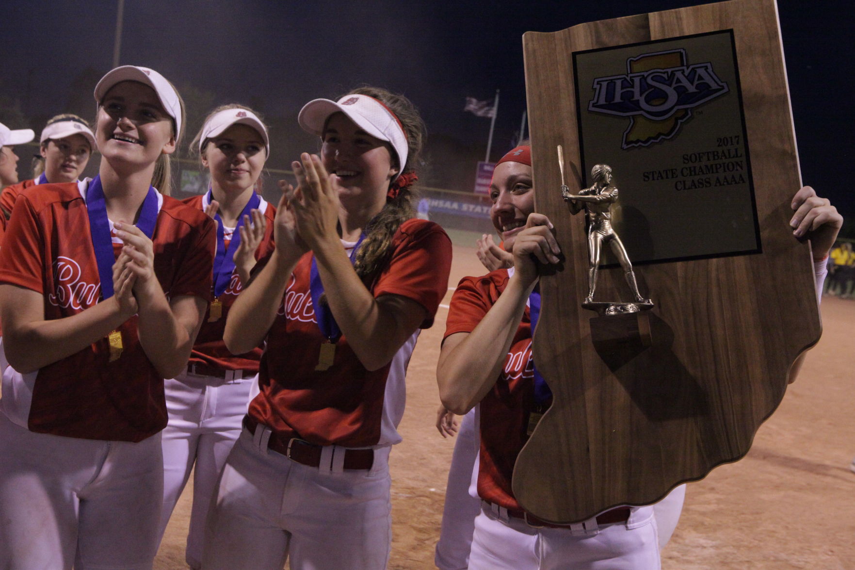 Crown Point players hoist trophy